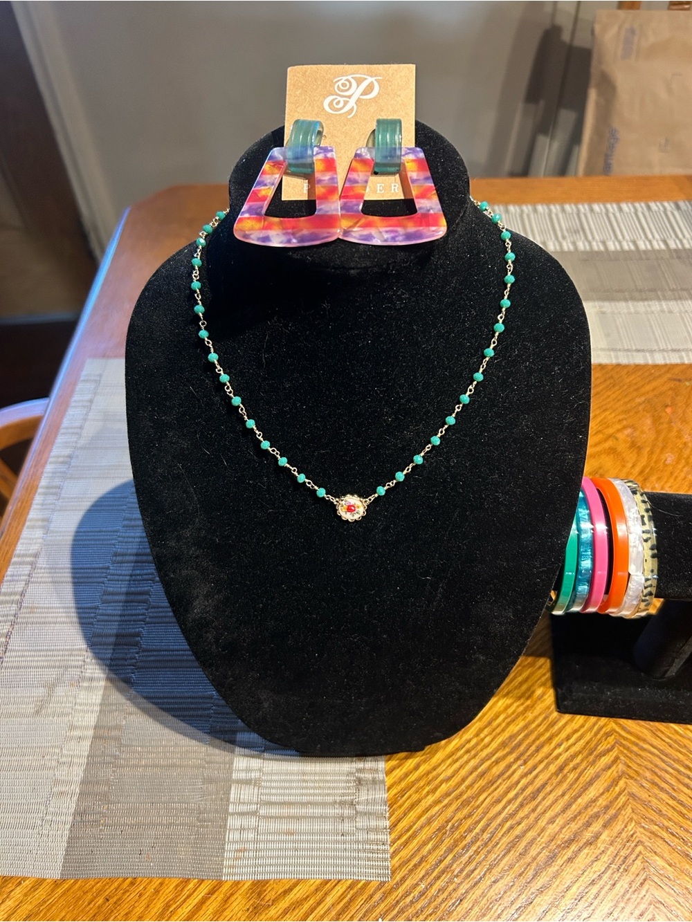Plunder Green Beaded Necklace with Floral Charm, earrings and ) piece bracelets.